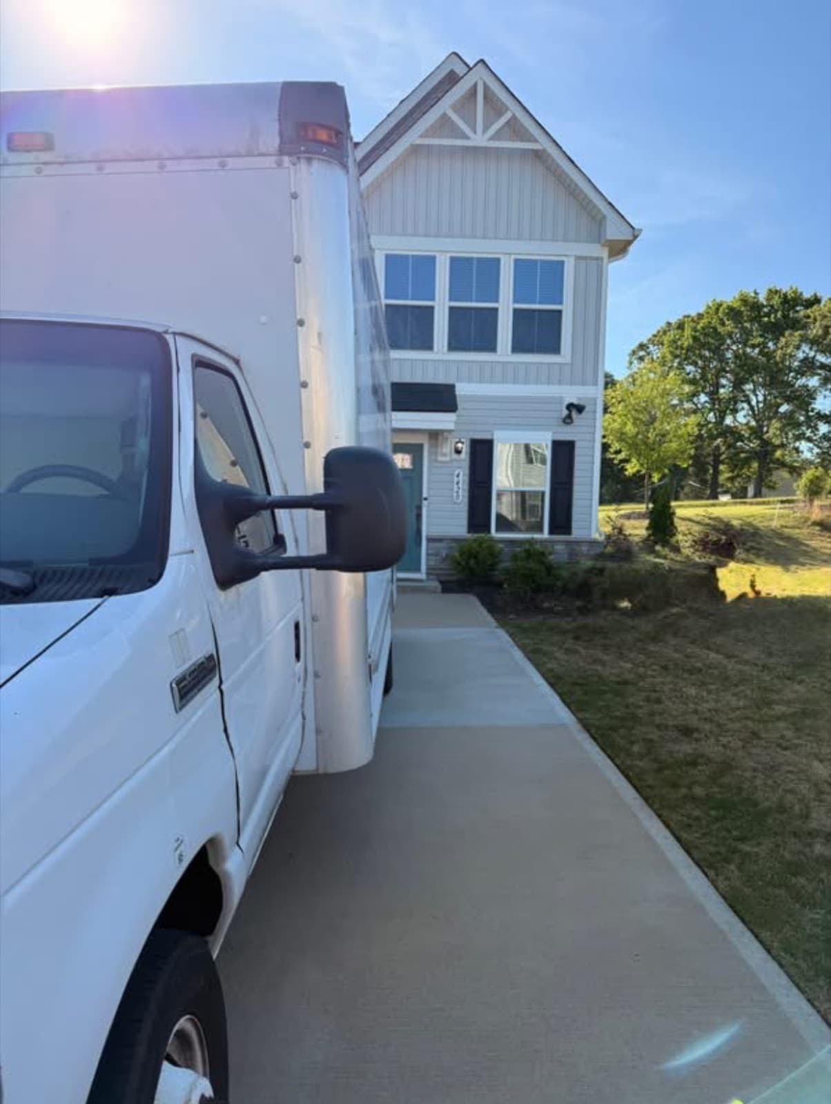 Heritage Moving box truck parked in the driveway of an Overland Park home, ready for a local move